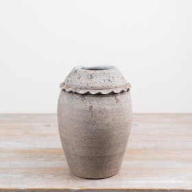 Bring rustic charm and architectural flair to your décor with this textured urn