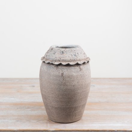 Add rustic, architectural interest to your space with this Textured  Urn