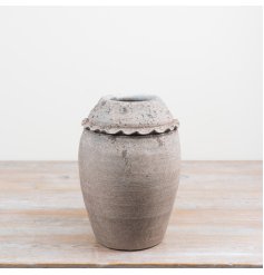 Add rustic, architectural interest to your space with this Textured  Urn