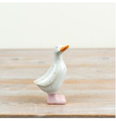 a charming glazed spotty pastel pink duck ornament