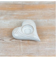 Elegant heart design glass tealight holder perfect for cosy home accents