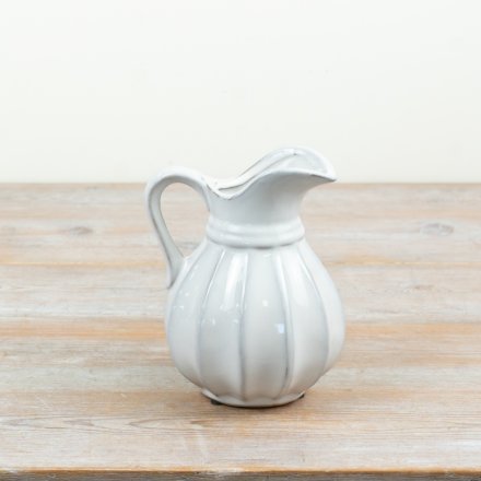 A stylish ribbed ceramic jug perfect for serving and display
