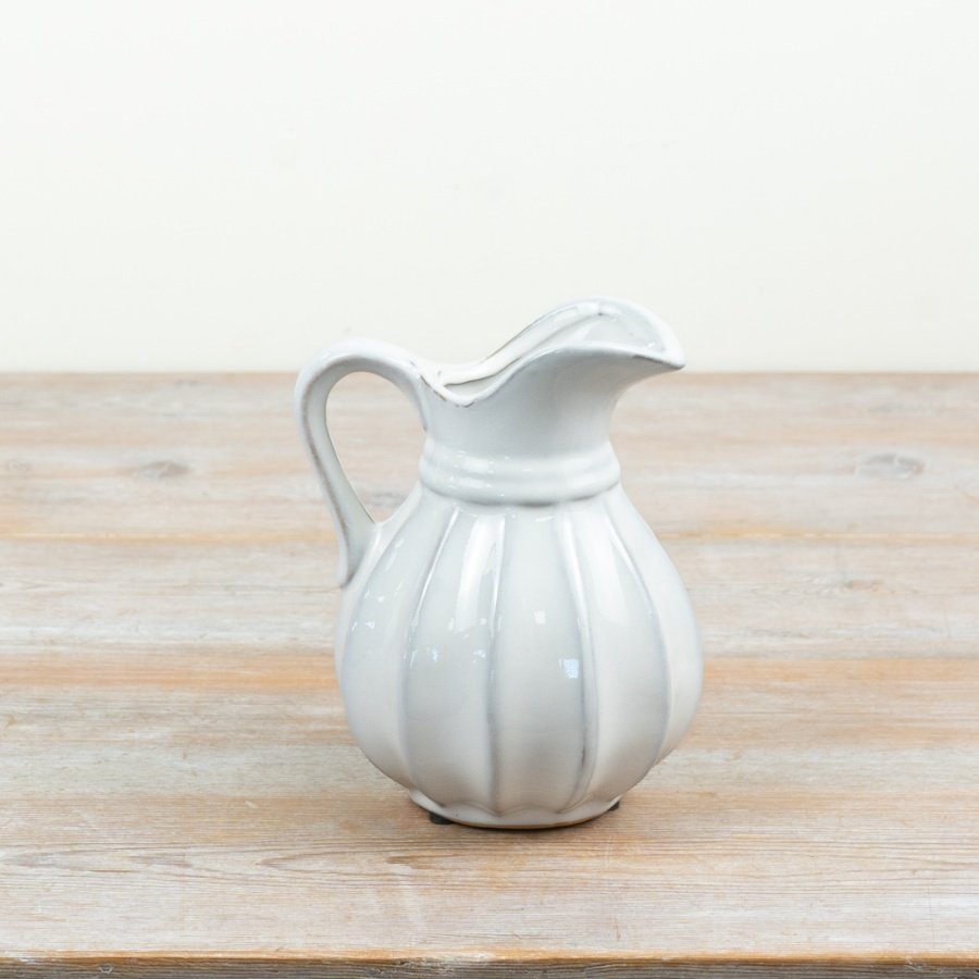 Chic ribbed ceramic jug ideal for serving drinks or displaying blooms