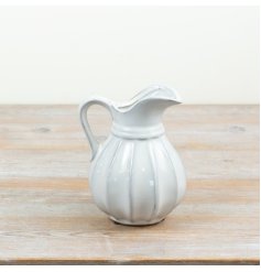 A stylish ribbed ceramic jug perfect for serving and display