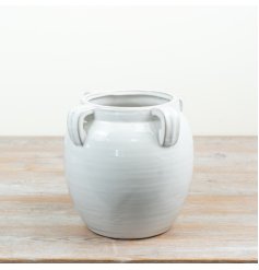 Its classic silhouette vase for statement floral displays.