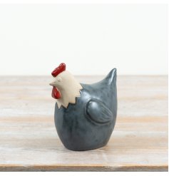 Bring charming rustic flair to your home with this cosy hen ornament