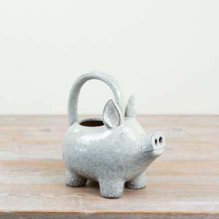 Add a touch of whimsy to your gardening routine with our speckled pig watering can
