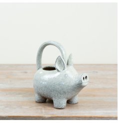 Add a touch of whimsy to your gardening routine with our speckled pig watering can