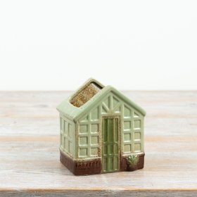 Charming miniature house planter featuring an open top and detailed window designs