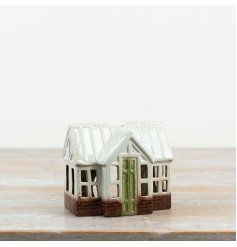 Bring a splash of colour and warmth to your home with this charming tealight holder cottage
