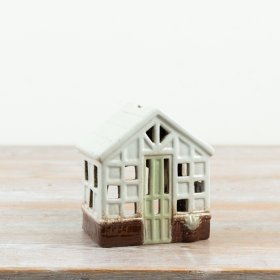 a delightful green miniature greenhouse tealight holder