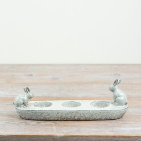 adorable bunny-themed tea light holder with a unique boat-shaped base