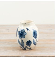 a delightful blue floral urn-shaped vase with folk-art charm