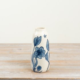 a striking glossy vase adorned with deep blue floral motifs
