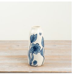 Elegant glossy blue vase adorned with delicate petal detailing