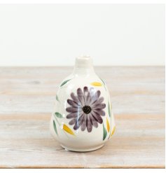 a delightful glazed bud vase with a striking indigo flower design