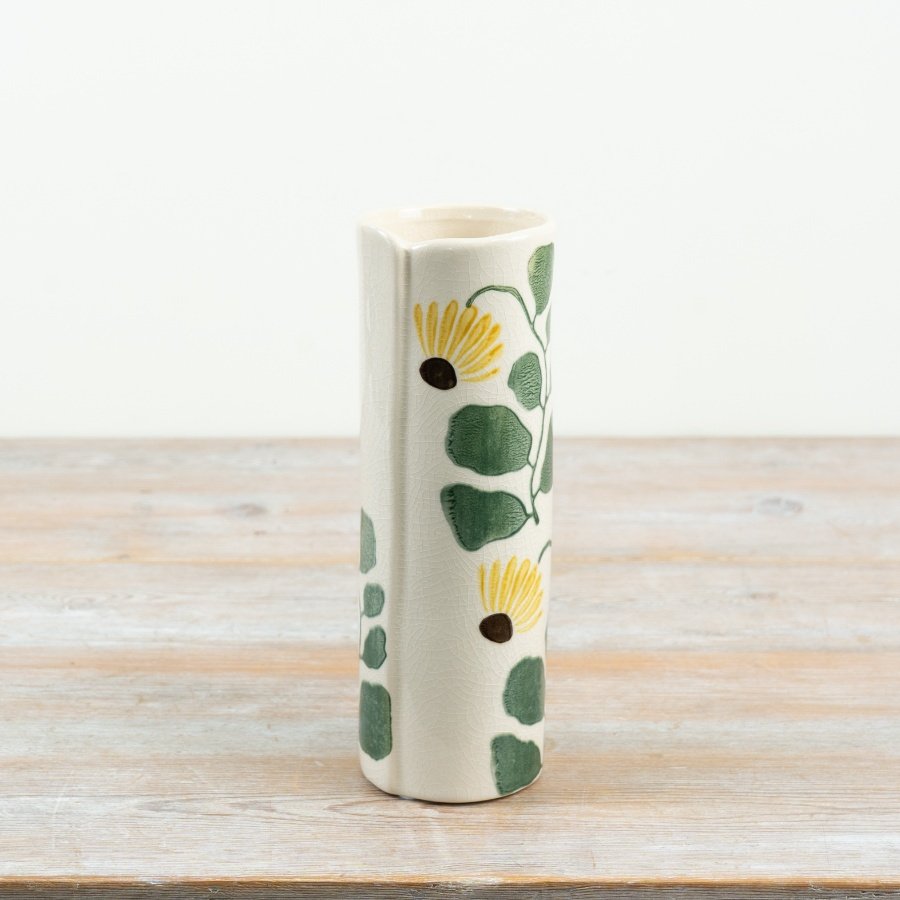 Invite the charm of the outdoors inside with this delightful ceramic vase adorned with sunflowers