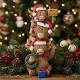 Embrace festive joy with this charming stacked Highland Cow family decoration