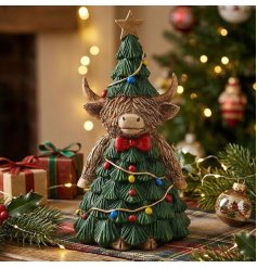 add a splash of fun to your table with this highland cow ornament 