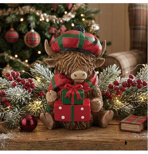 a delightful Highland cow figurine dressed in vibrant tartan accessories