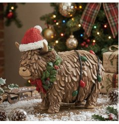 a charming highland cow xmas ornament