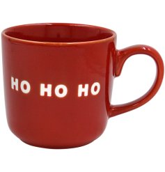 A delightful bright red mug full of holiday spirit