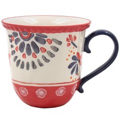 a charming bright patterned coffeee mug