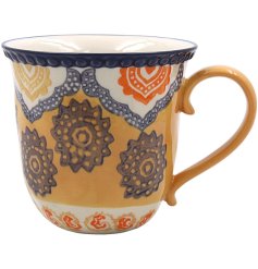 Brighten up your morning coffee or evening tea ritual with this vibrant Bohemian-style ceramic mug