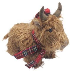 charming Highland cow doorstop with traditional Scottish flair