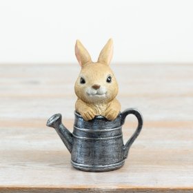 a delightful resin rabbit resting in a watering can ideal for garden or patio decor