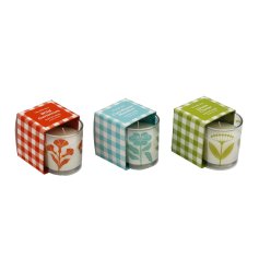 Enjoy the cosy flicker and floral notes of these tastefully boxed candles