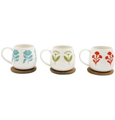 Delight in every sip with this elegant flower-themed mug and matching coaster set