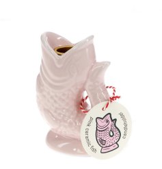 a charming pastel pink taper candle 