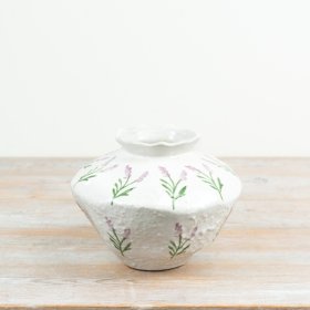 Delicate purple lavender sprigs and soft green foliage bring a calm, garden-inspired charm