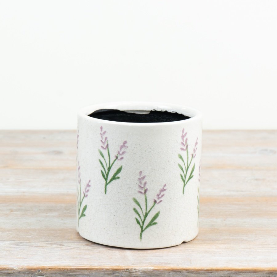Delicate lavender sprigs repeated on a soft cream backdrop