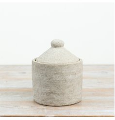 Capture earthy charm with this beautifully textured cement jar featuring a simple lid