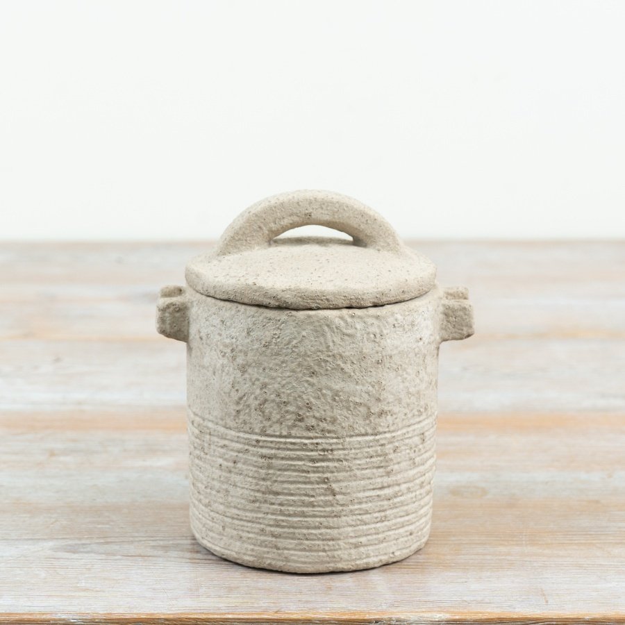 introduce a touch of countryside warmth with this rugged, earthy storage pot with lid