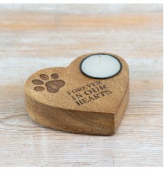 a delightful wooden heart tea light holder featuring a paw engraving