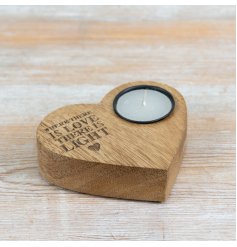 Create a warm, inviting atmosphere with this charming heart-crafted wooden tea light holder