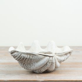 a delightful coastal-inspired trinket plate with a shell motif