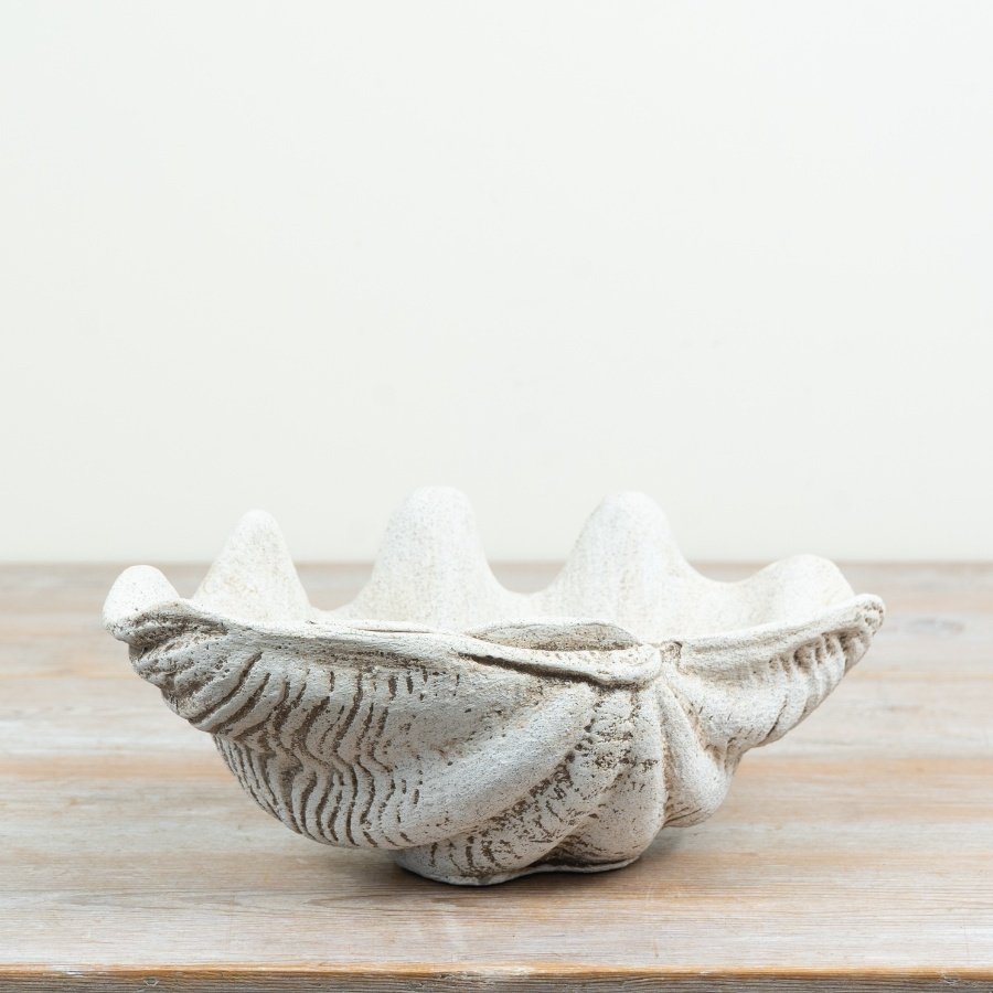 a delightful coastal-inspired trinket plate with a shell motif