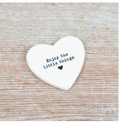 Delight in life's simple joys with this delicate porcelain heart token