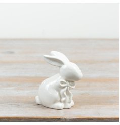 an elegant porcelain-style white rabbit with a delicate bow detail