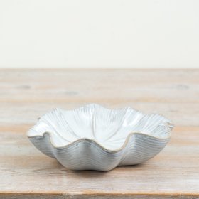 An elegant, minimalist bowl with a scalloped design ideal for stylish storage