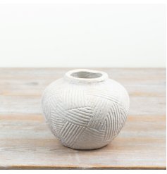 a stylish textured white vase 