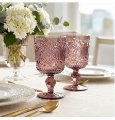 a charming set of 2 purple embossed wine glasses 