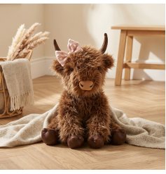 Add a cosy rural touch with Hatty, the Highland Cow doorstop adorned with a pretty pink bow