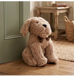 Keep your doors ajar with our snug, shaggy pup doorstop radiating warmth and charm