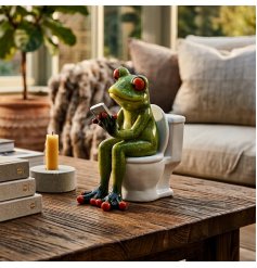 Bring a whimsical touch to your bathroom with this cheeky frog ornament