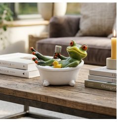 Bring a touch of whimsical delight to your décor with this amusing frog ornament
